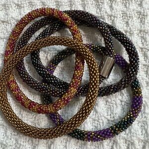 5 Sashka Co beaded bangle bracelets.  Metallic brown/blue/purple.  Approx  8”.